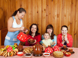 Wall Mural - Happy family  drinking tea