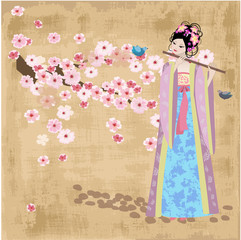 Fotomurales - Beautiful Oriental girl near cherry blossoms