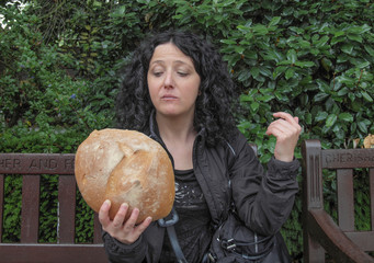 Wall Mural - Girl eating bread