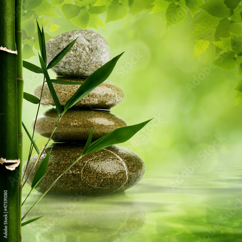 Naklejka ścienna Natural zen backgrounds with bamboo leaves and pebble for your d