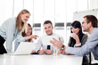 © baranq - Group of business people working at office