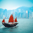 traditional wooden sailboat sailing in victoria harbor 