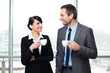 © baranq - Businessman and businesswoman drinking coffee
