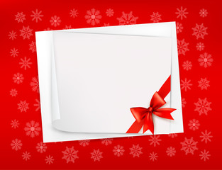 Wall Mural - Christmas sheet of paper and red ribbon gift background. Vector