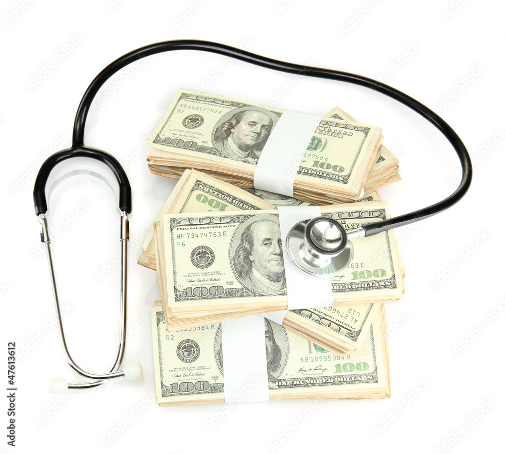 Healthcare cost concept: stethoscope and dollars isolated