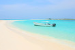 Boat at the tropical beach of Los Roques