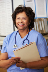 Wall Mural - Female Nurse At Nurses Station