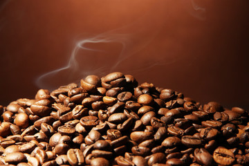 Wall Mural - coffee beans on brown background