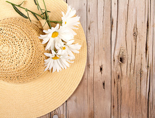 sun hat on wooden plank