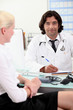 © auremar - Doctor consulting with a patient