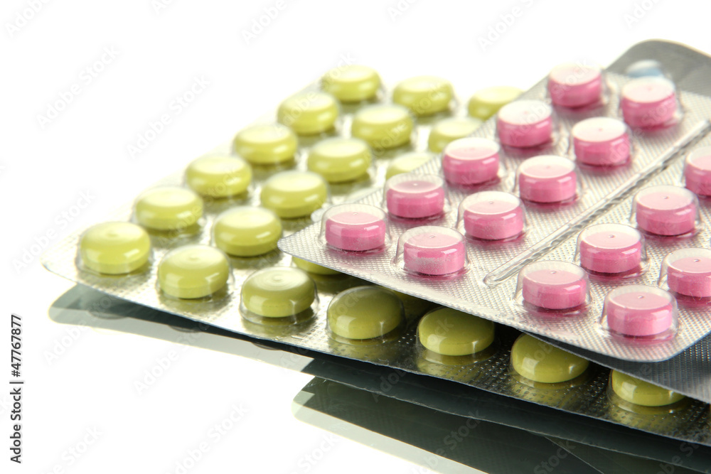 pills packed in blisters, isolated on white