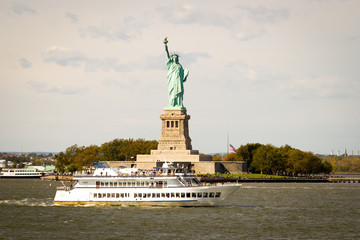 tourists flocking to the statue of liberty, new york