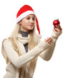 © lenets_tan - Young woman on santa hat holding Christmas ball