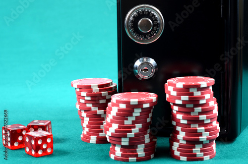 Poker gambling chips on a green playing table плакат