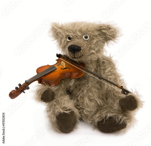 Fototapeta na wymiar ours en peluche musicien