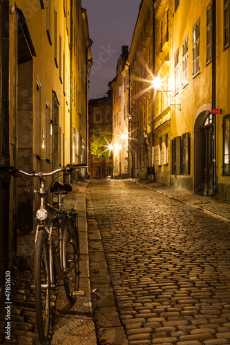 Fototapeta na wymiar Empty street in Stockholm Old town at night.