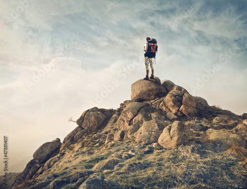 Fototapeta na wymiar Traveler on a Rock