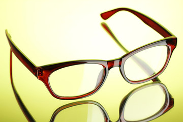 Poster - Beautiful glasses on green background