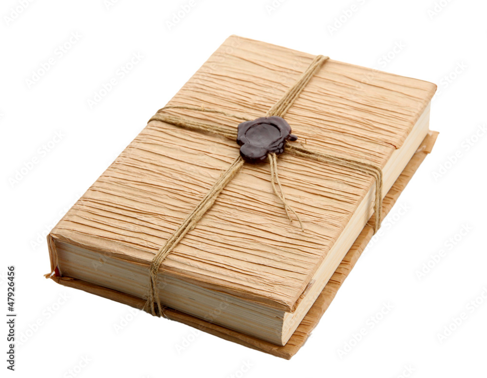 Old book with seal wax, isolated on white