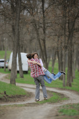 Young Couple Spinning Outside