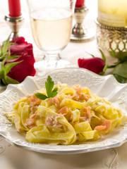 Poster - tagliatelle with salmon and cream sauce on luxury table