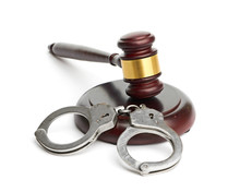 A Pair Of Handcuffs And Gavel