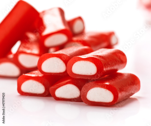 Fototapeta na wymiar Stuffed red licorice bars white gummy