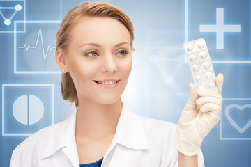 Poster - attractive female doctor with pills