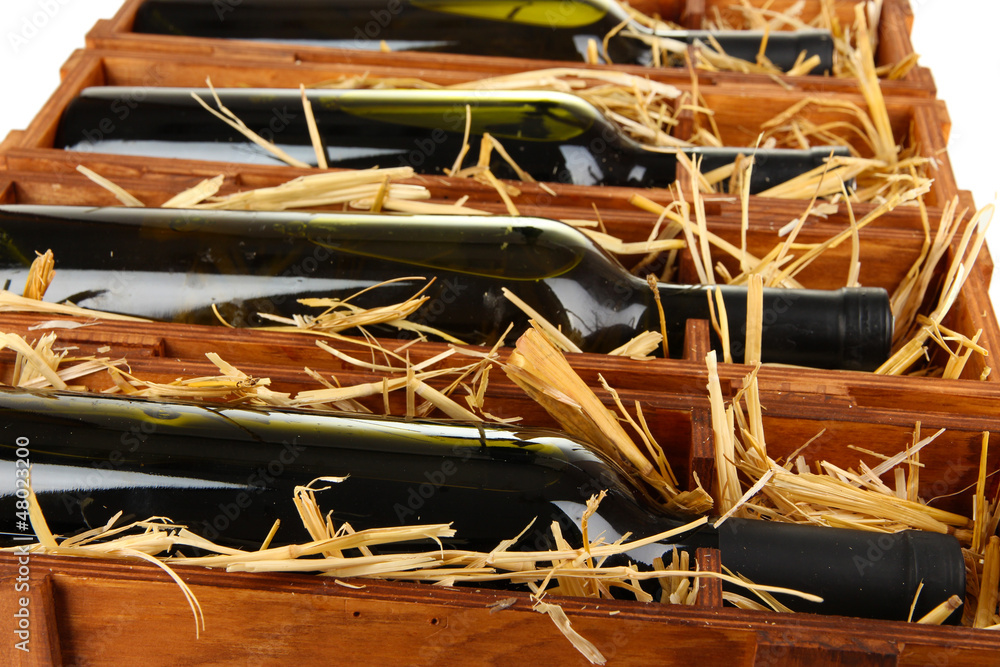 Wooden case with wine bottles close up