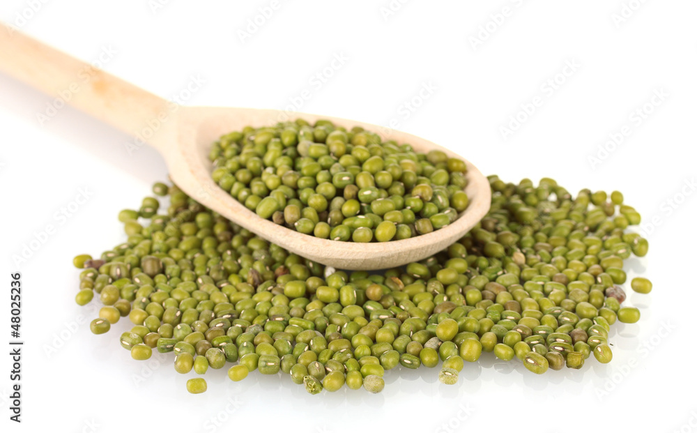 Mung beans over wooden spoon isolated on white