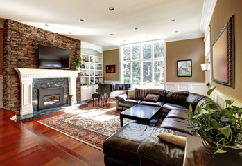 Wall Mural - Luxury living room with stobe fireplace and leather sofas.