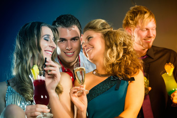  People in club or bar drinking cocktails