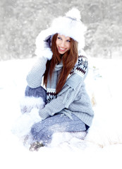 Wall Mural - Attractive young woman in wintertime outdoor