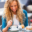 © william87 - Young Couple Having a Traditional Italian Breakfast