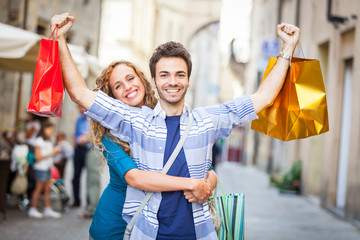 Happy Young Couple with Shopping Bags