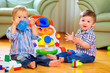 © Olesia Bilkei - funny baby toddlers playing toys at home