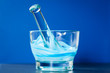 Glass mortar and pestle with blue compound