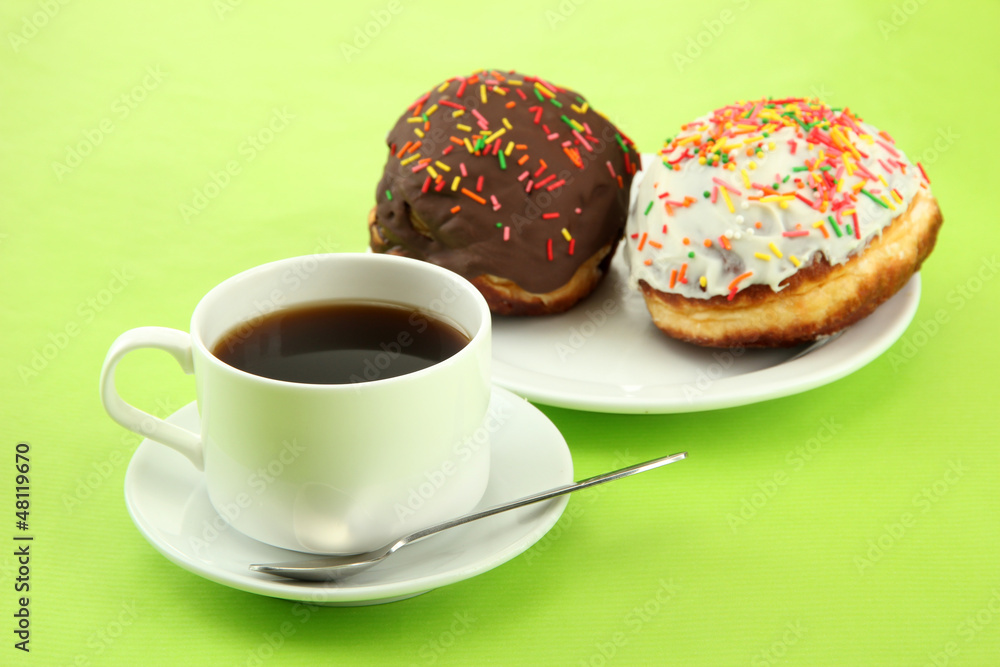 Tasty donuts on color plate on color background