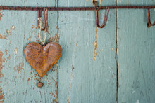 Rusty Old Heart On Wooden Background