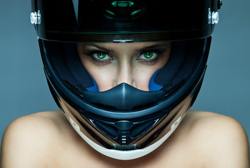 Fotobehang - sexy woman in helmet on blue background