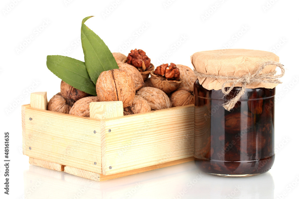 jam-jar of walnuts and a wooden box with walnuts