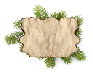 Old parchment paper with copy space on Christmas tree branch bac