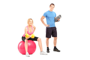 Sticker - A male and female athletes with equipment posing