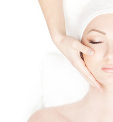 Portrait of a young woman in a towel on a spa procedure