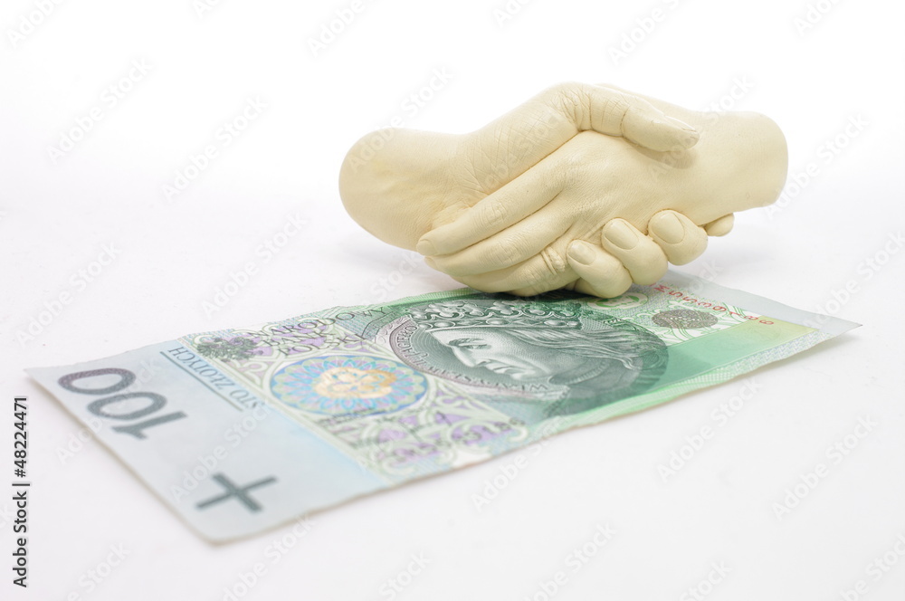 Splecione dłonie nad banknotem 100 zł  - obrazy, fototapety, plakaty 