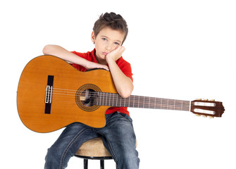 Sad white boy with a  acoustic guitar in his hands.