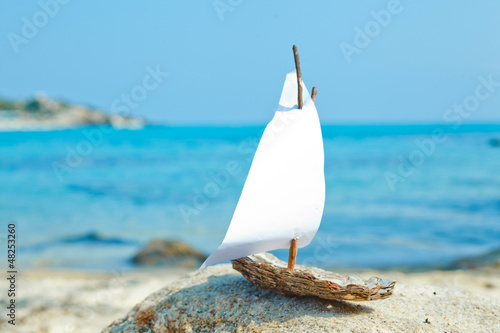 Naklejka na kafelki Ship toy model on the beach