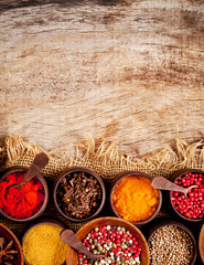 Wall Mural - Various kind of spices in wooden bowls