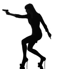 Poster - sexy detective  woman holding aiming  gun silhouette