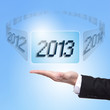 © ryanking999 - Business man holding screen with 2013